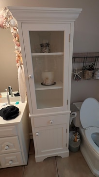 One of 3 bathrooms, nicely decorated and extra linens were sealed in plastic and in the bathroom closet.