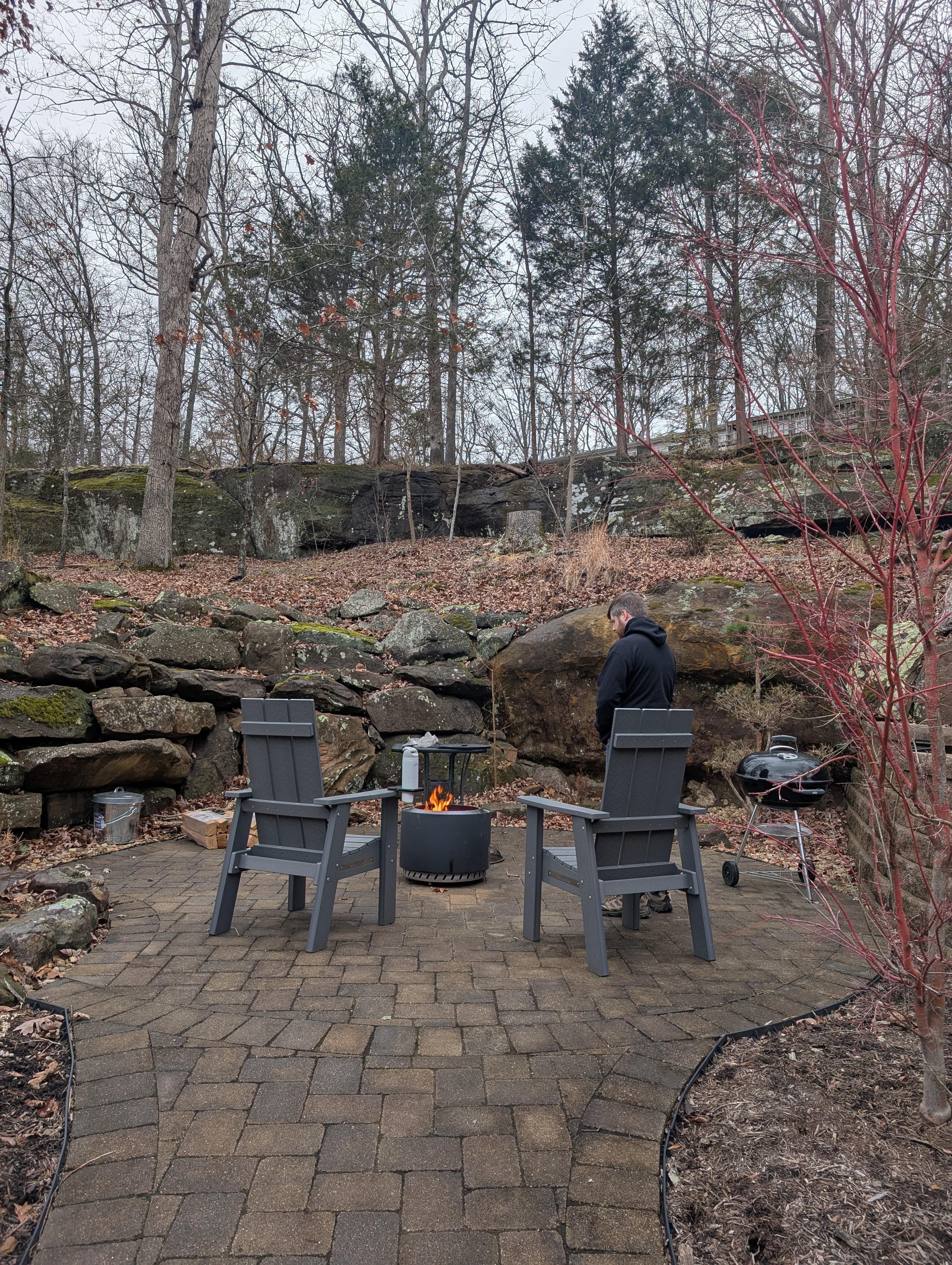 The fire pit/grill area is up against a natural rock formation and is very pretty. The whole yard is very private and serene 