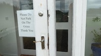 View of rotting wood on the door frame