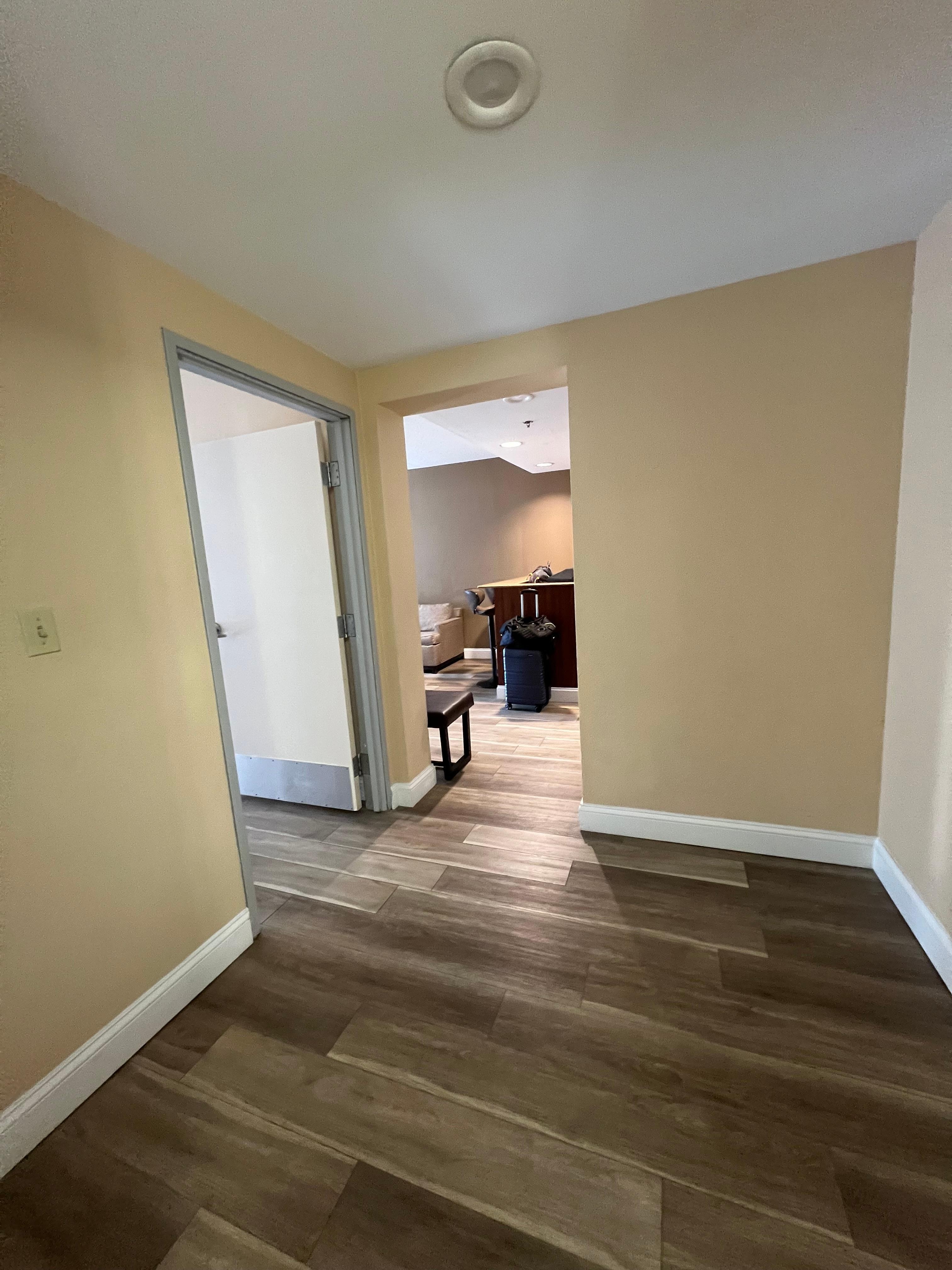 Area to the left when you walk in that goes to the bathroom & bedroom 