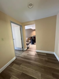 Area to the left when you walk in that goes to the bathroom & bedroom