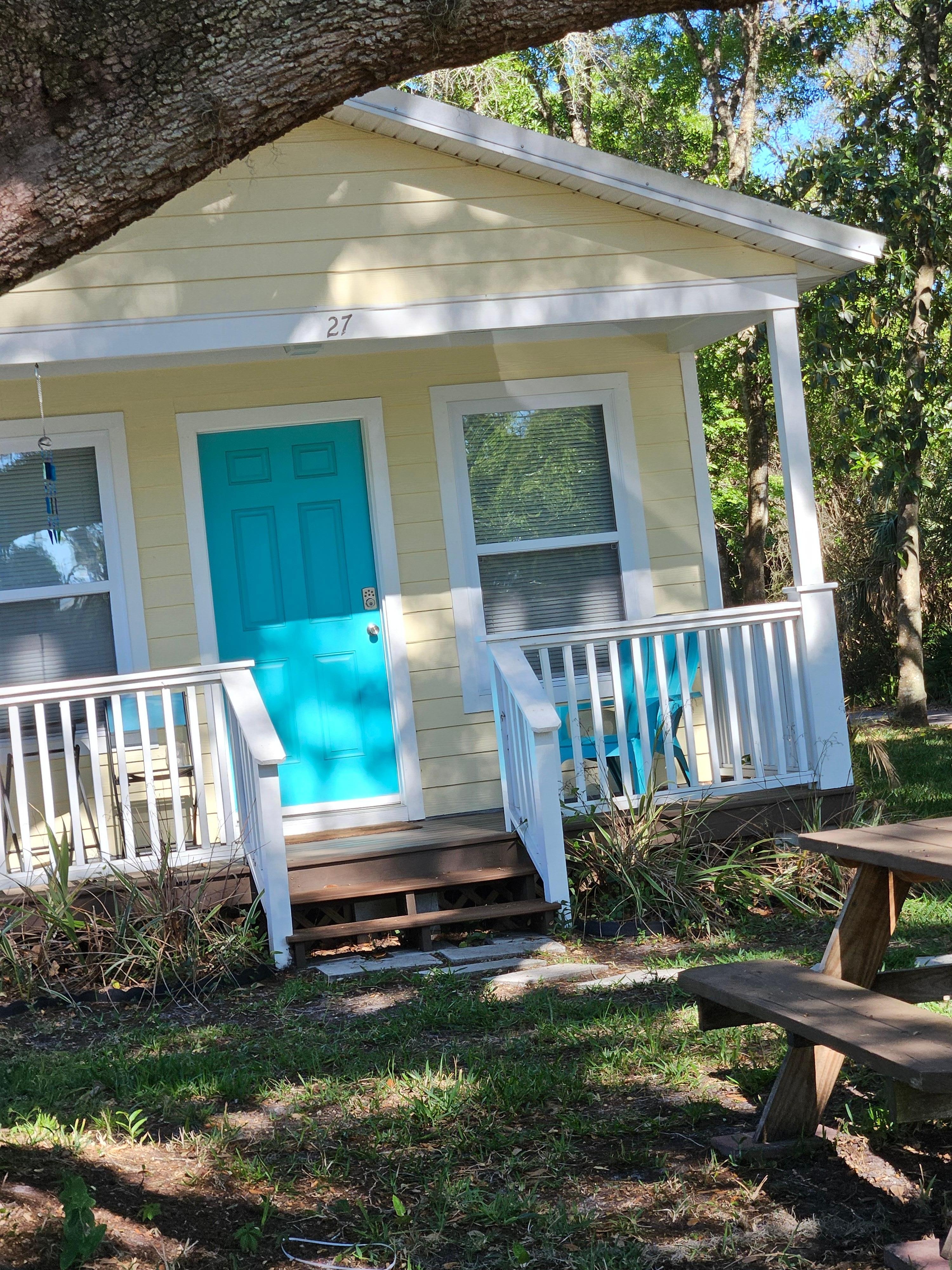 Front yard with shade and a picnic table. 