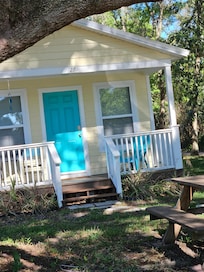 Front yard with shade and a picnic table.