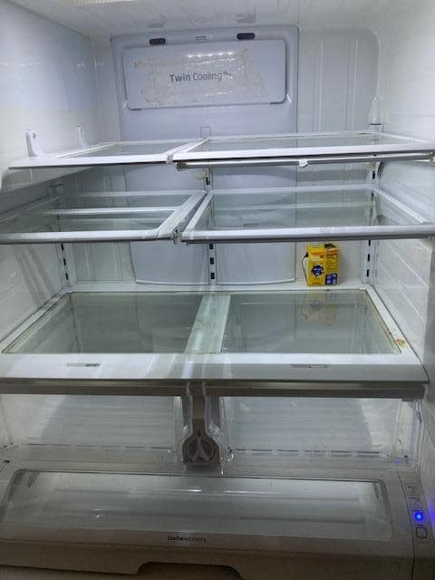 broken and dirty fridge