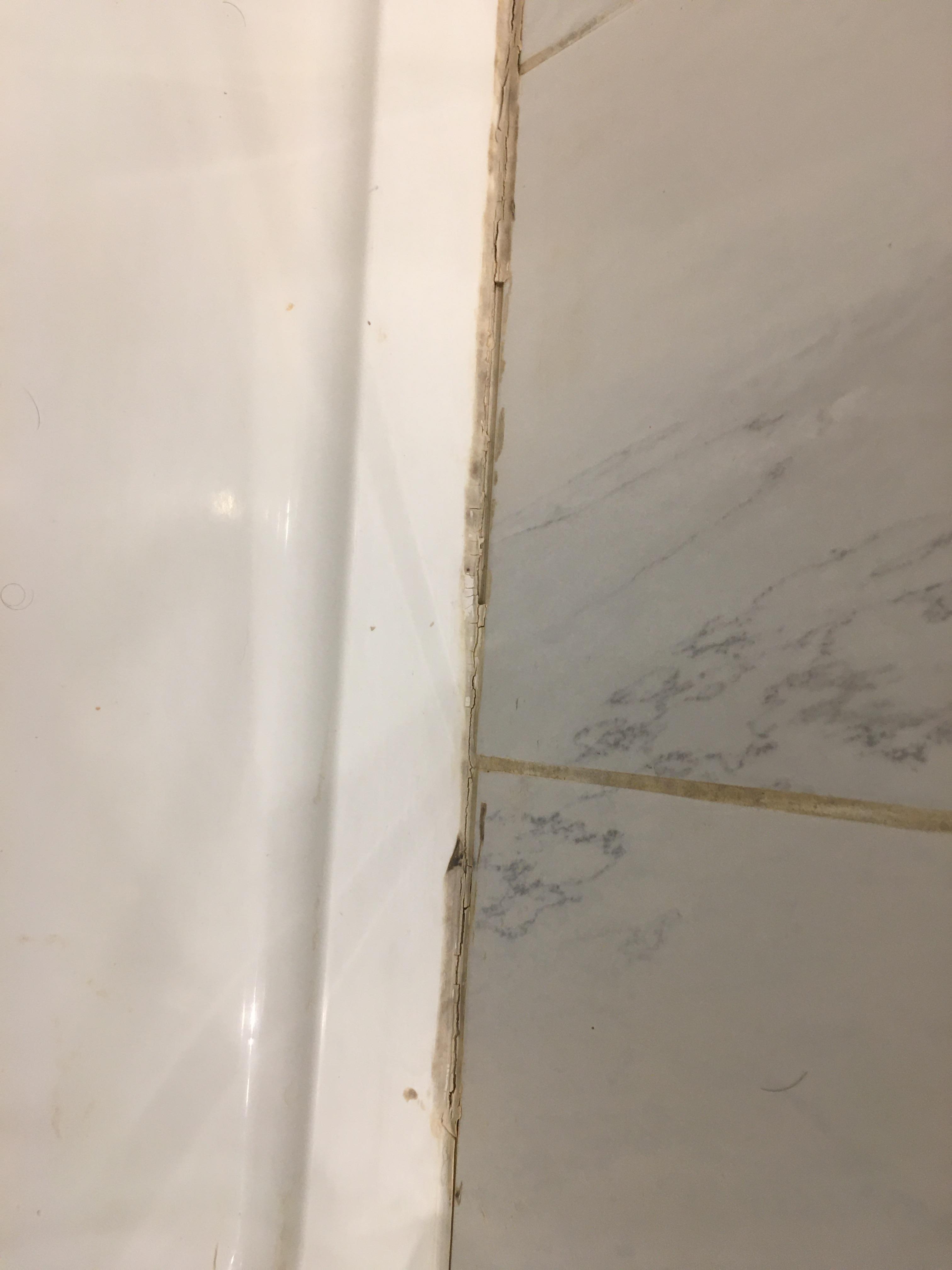 Shower silicon, needs replacement.