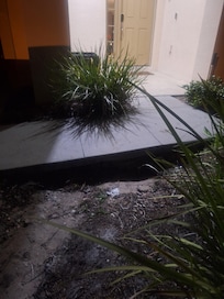Huge hole under entrance to the house.