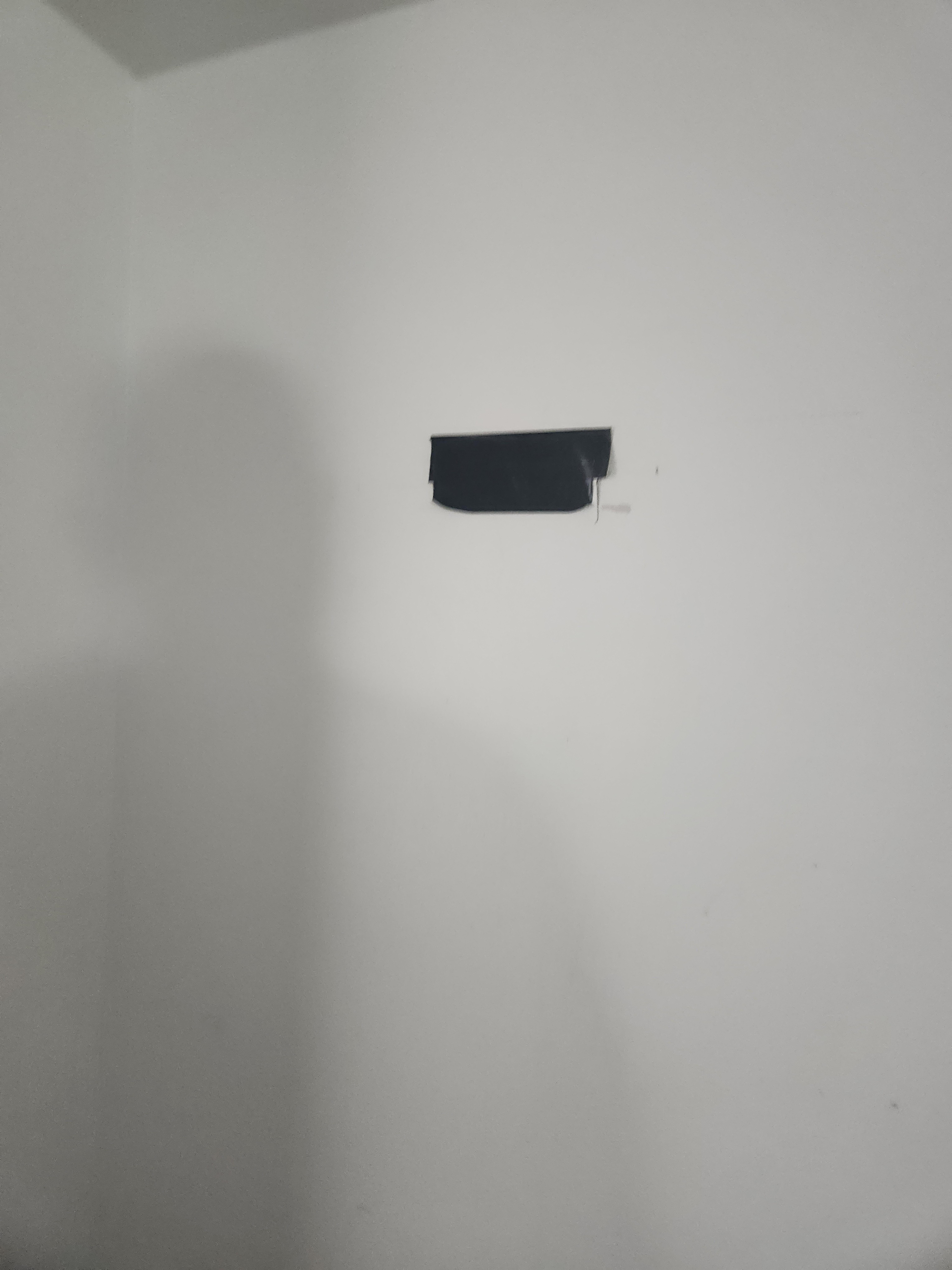 Something was torn off the wall so let's just duct tape it. 