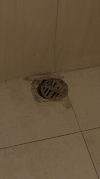 This is the side of the shower. A foul smell came out of that hole. The bathroom was dirty. No toiletries at all. Water was salty.