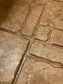 Deep grooves in the bathroom floor made me question how clean they were