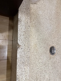 Broken tile in bathroom, shower would only work with shower head and handheld going at the same time.