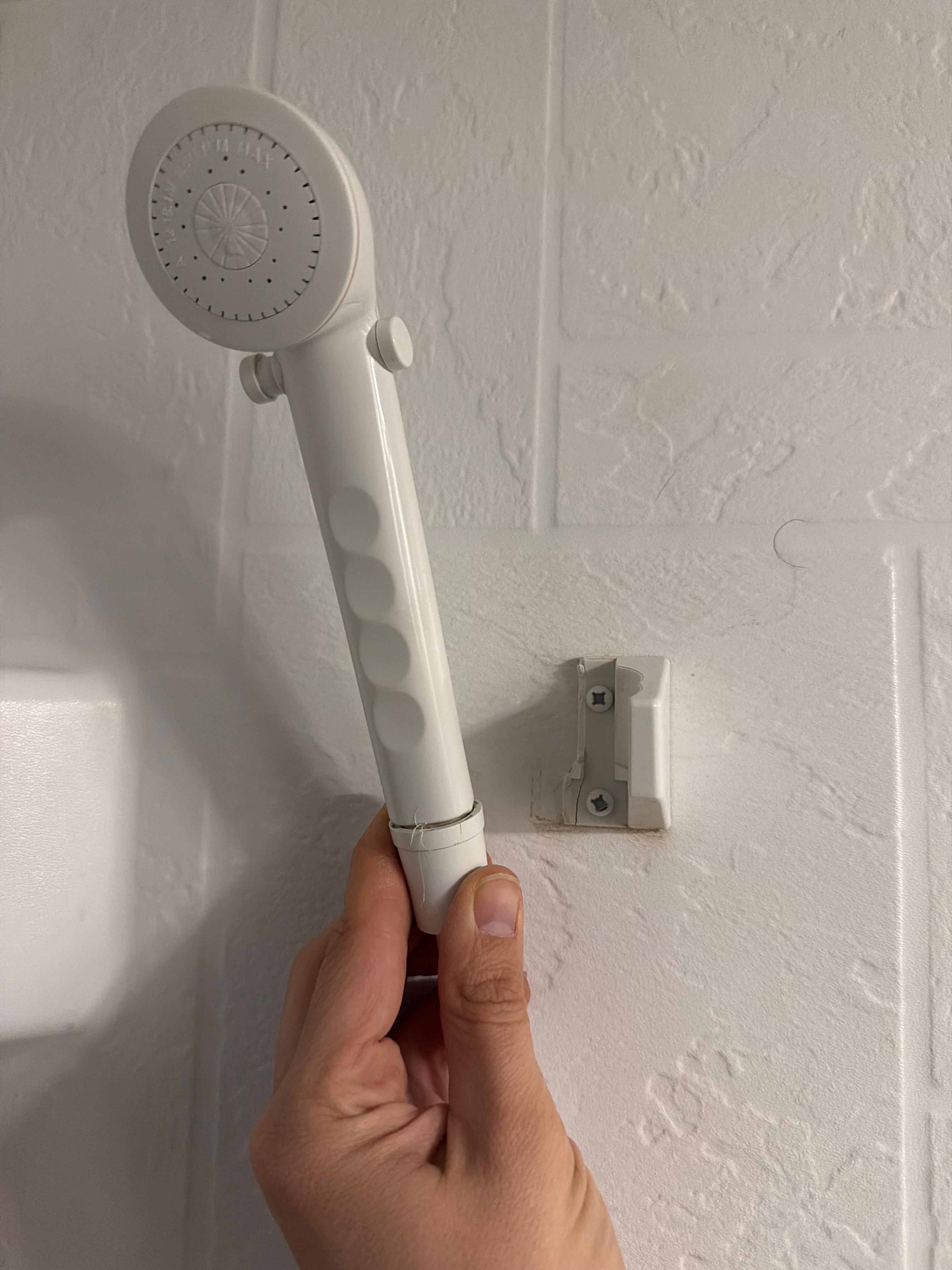 Broken bracket to hold shower head