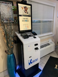 Kiosk for check-in.  You talk to someone from who knows where!