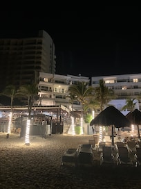 View at night from the beach facing the eating area ..