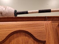 Grease and cobwebs on cabinet tops by stove