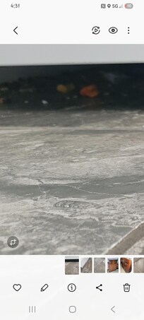 Looking from across the room on couch under oven