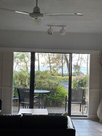 Living room looking out to bbq area and beach