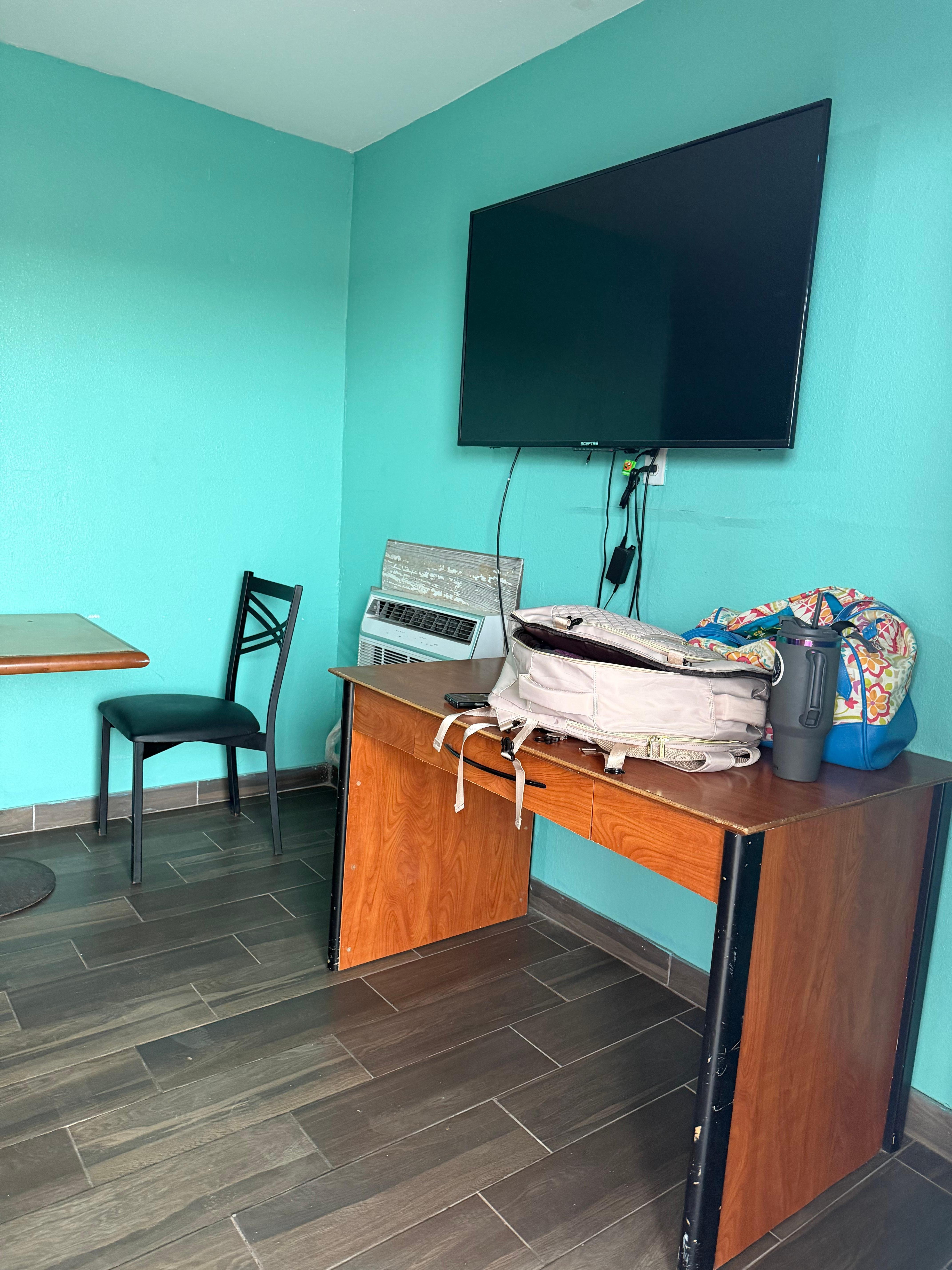 Tv and ac unit, right side of room door