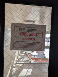 The sign from the health Dept leading to the pool, which was completely looked over by staff as they allowed entry and insured the pool is safe and well balanced, just don't use the hand rails