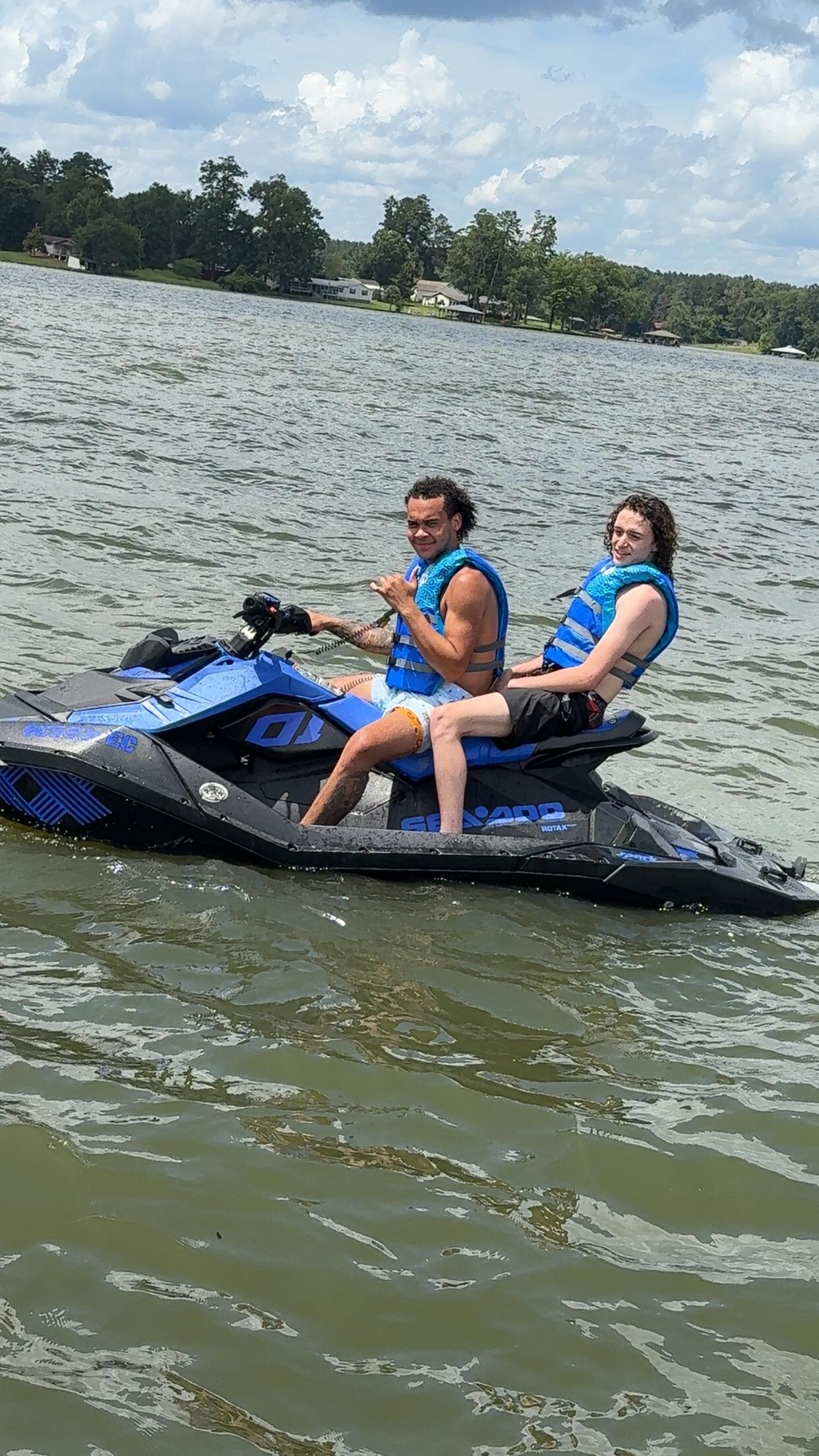 The boys riding their jet ski
