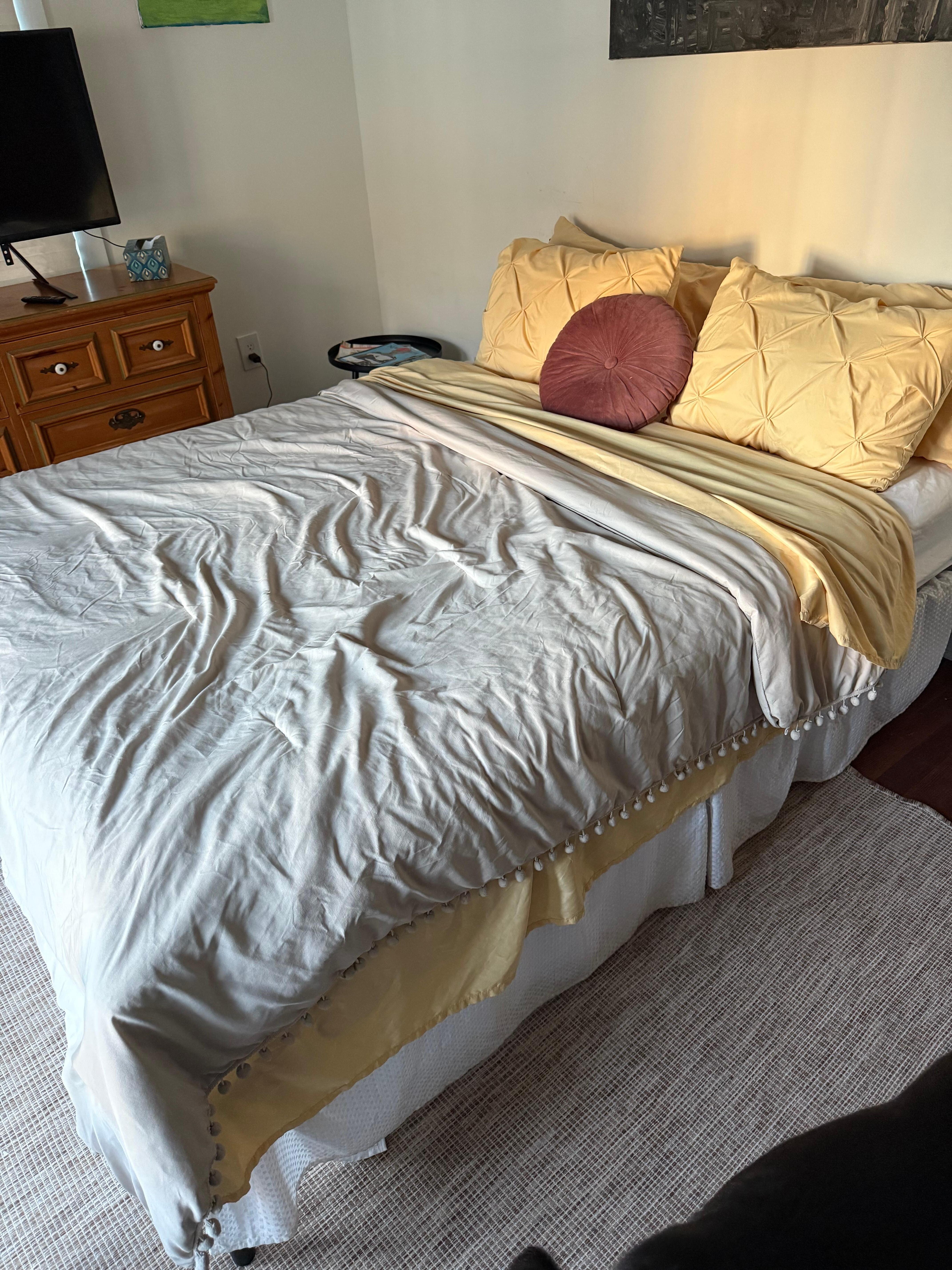 Rumpled bed covers and old bedding. 