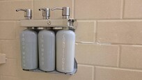 Shower caddy was taped to the wall