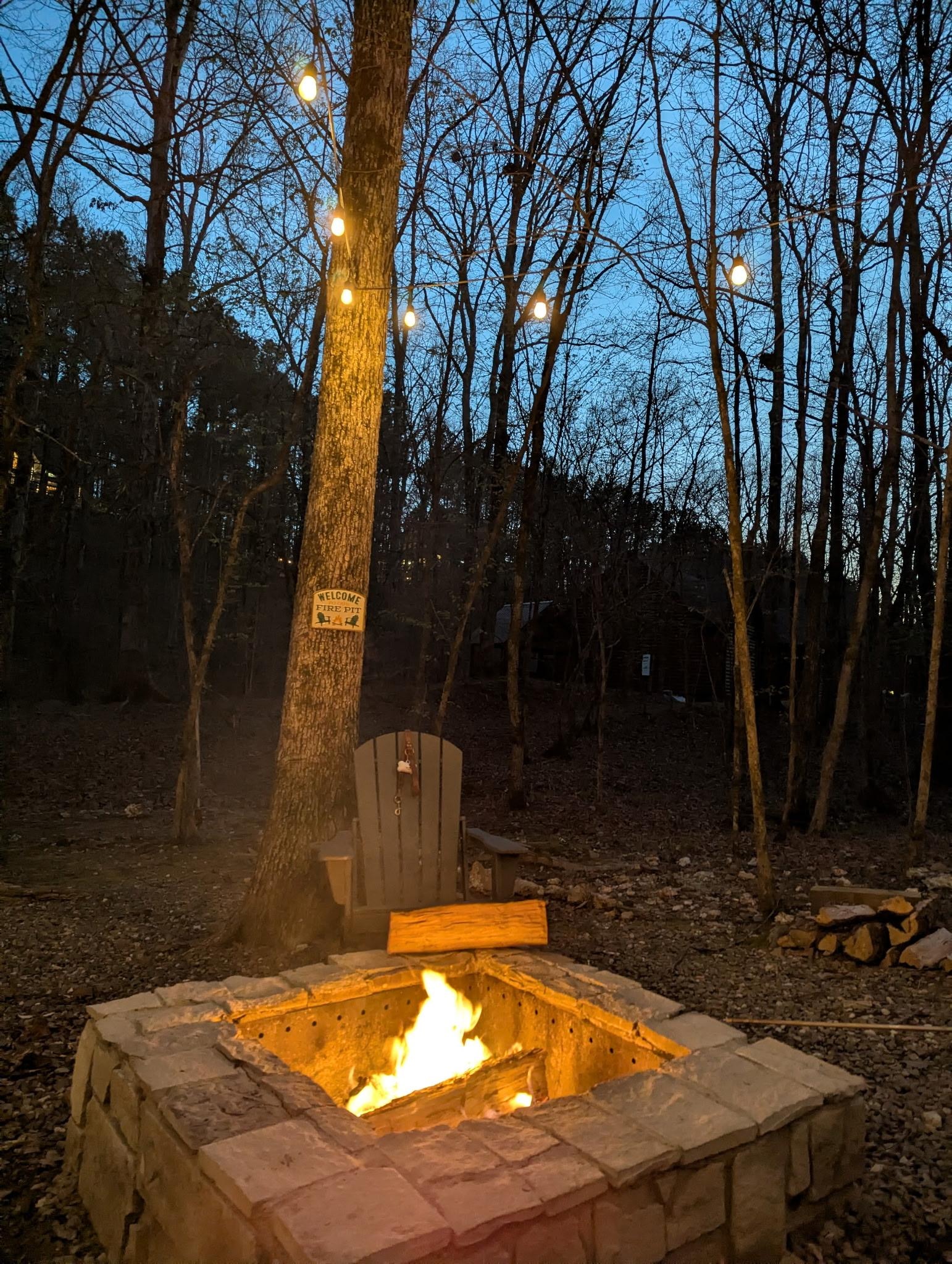Lights around fire pit and hammock.