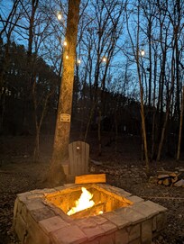 Lights around fire pit and hammock.
