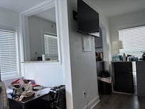 View from living room couch, shows kitchen and dining to the left.