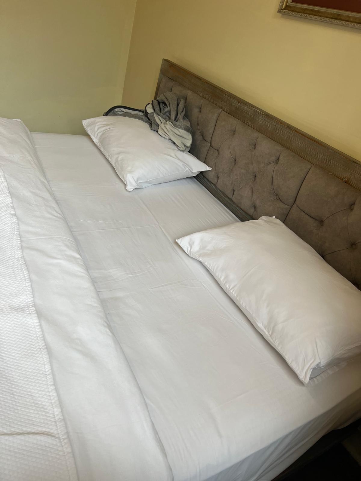 Left side of bed plaster coming off wall