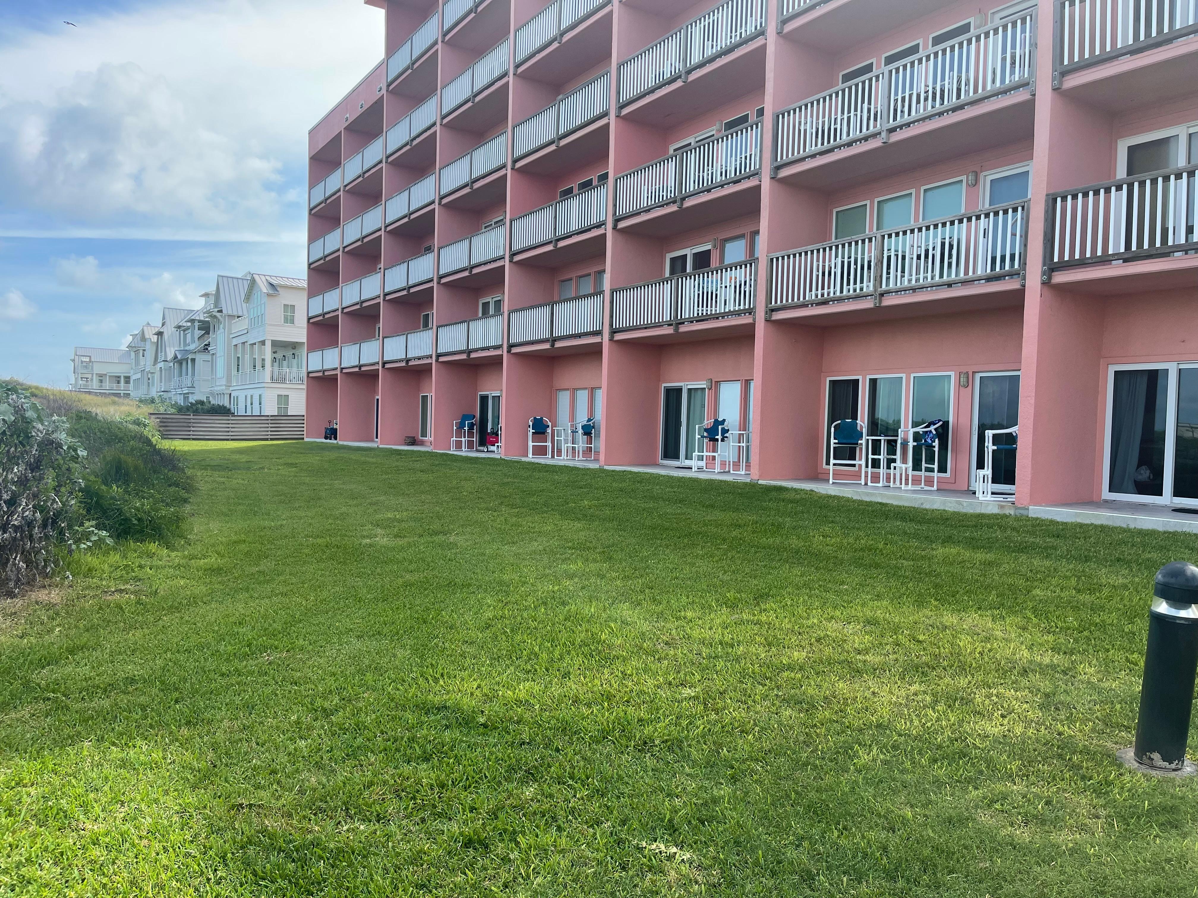 From boardwalk to room, 5th patio down with red wagon. 