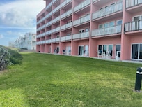 From boardwalk to room, 5th patio down with red wagon.