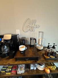 The super nice, well stocked coffee bar