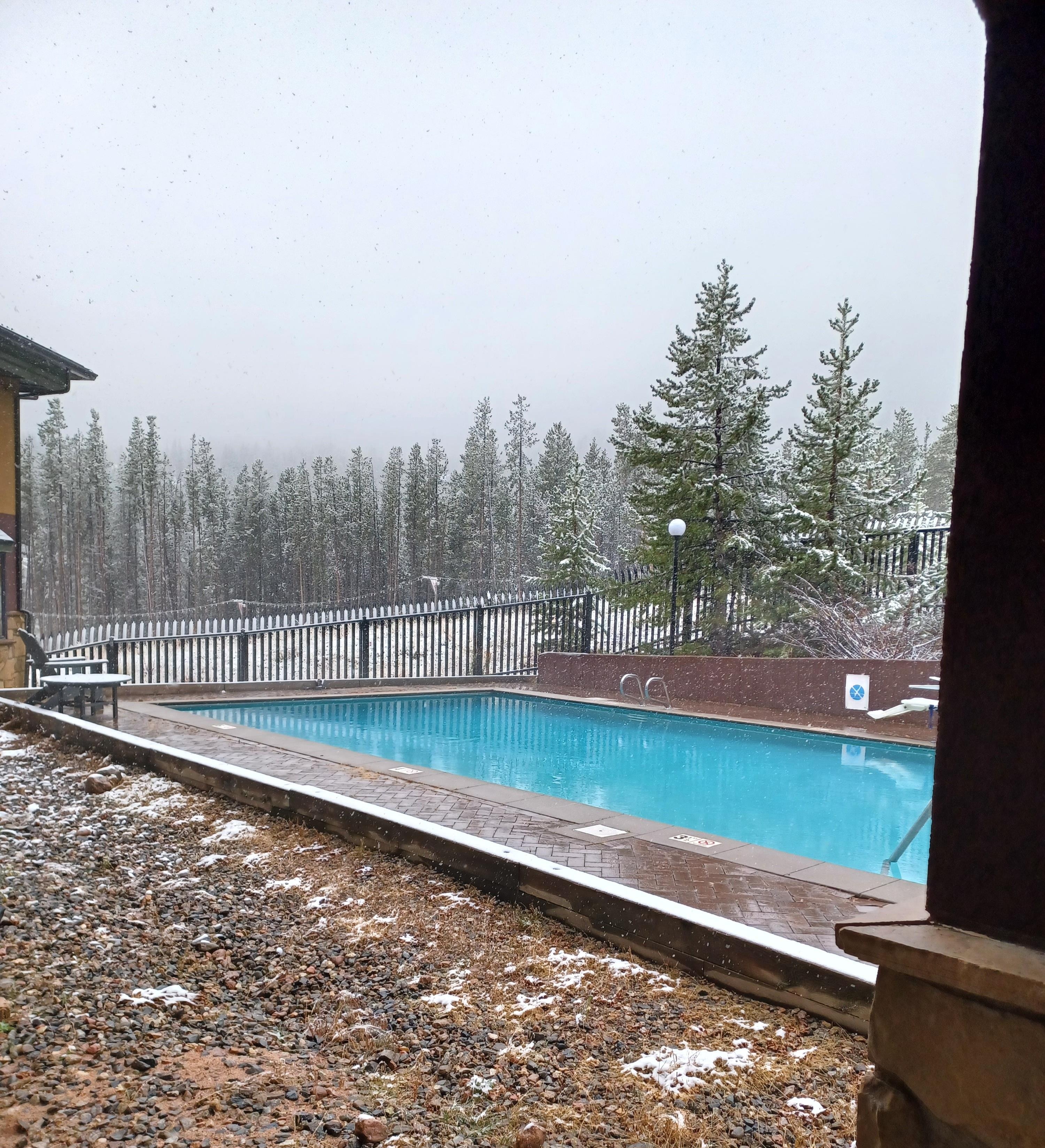 Pool view with light snow falling. 