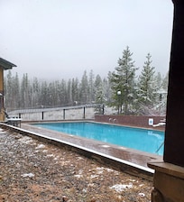 Pool view with light snow falling.