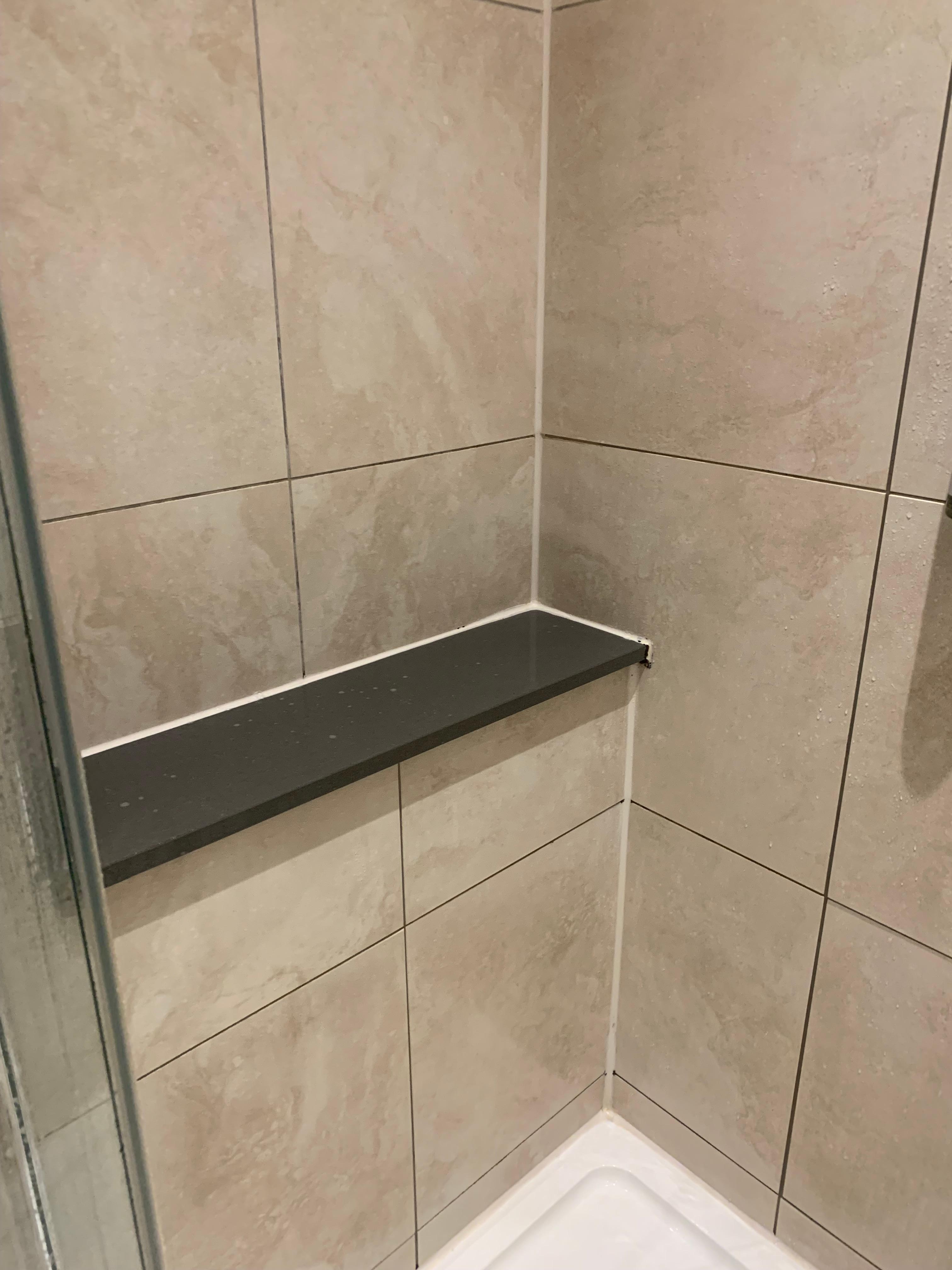 Spare place to put own items in the shower