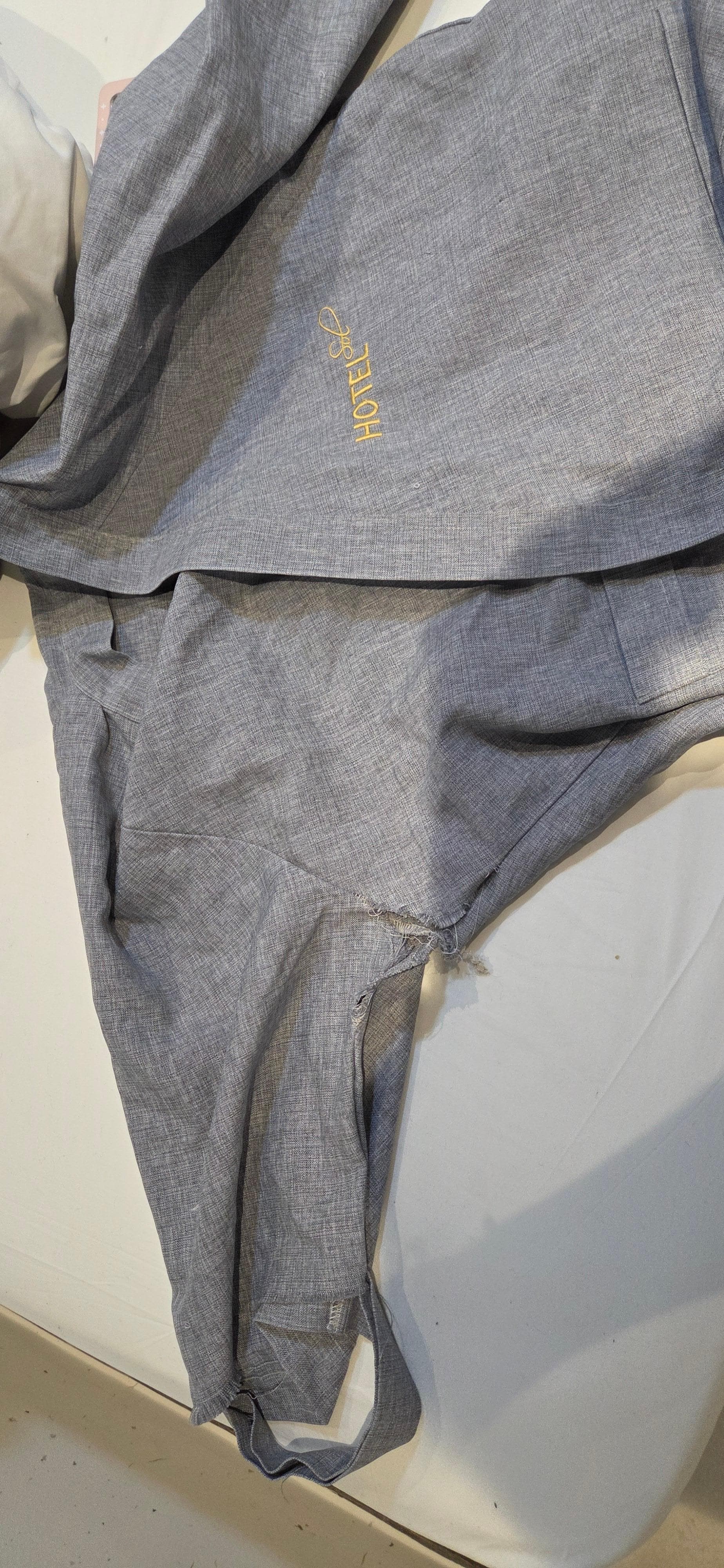 The provided robes had holes and tears in them.