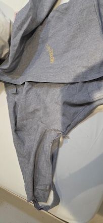 The provided robes had holes and tears in them.