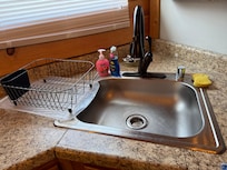 No garbage disposal (not the end of the world but a heads up would be nice!!), old sponge, all the soap bottles were similar to this - busted/dirty/old.