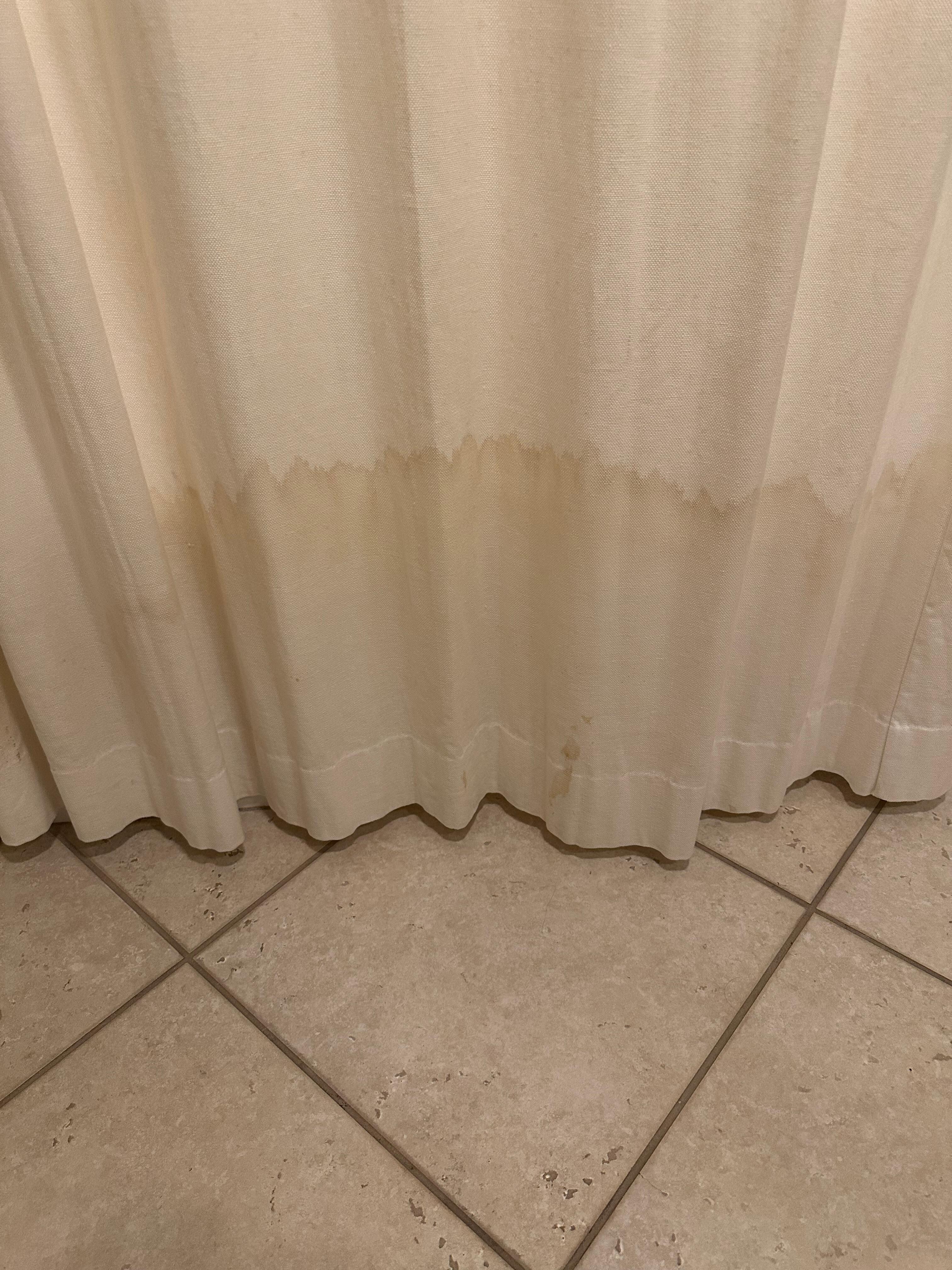 Decorative shower curtain was stained and molded 