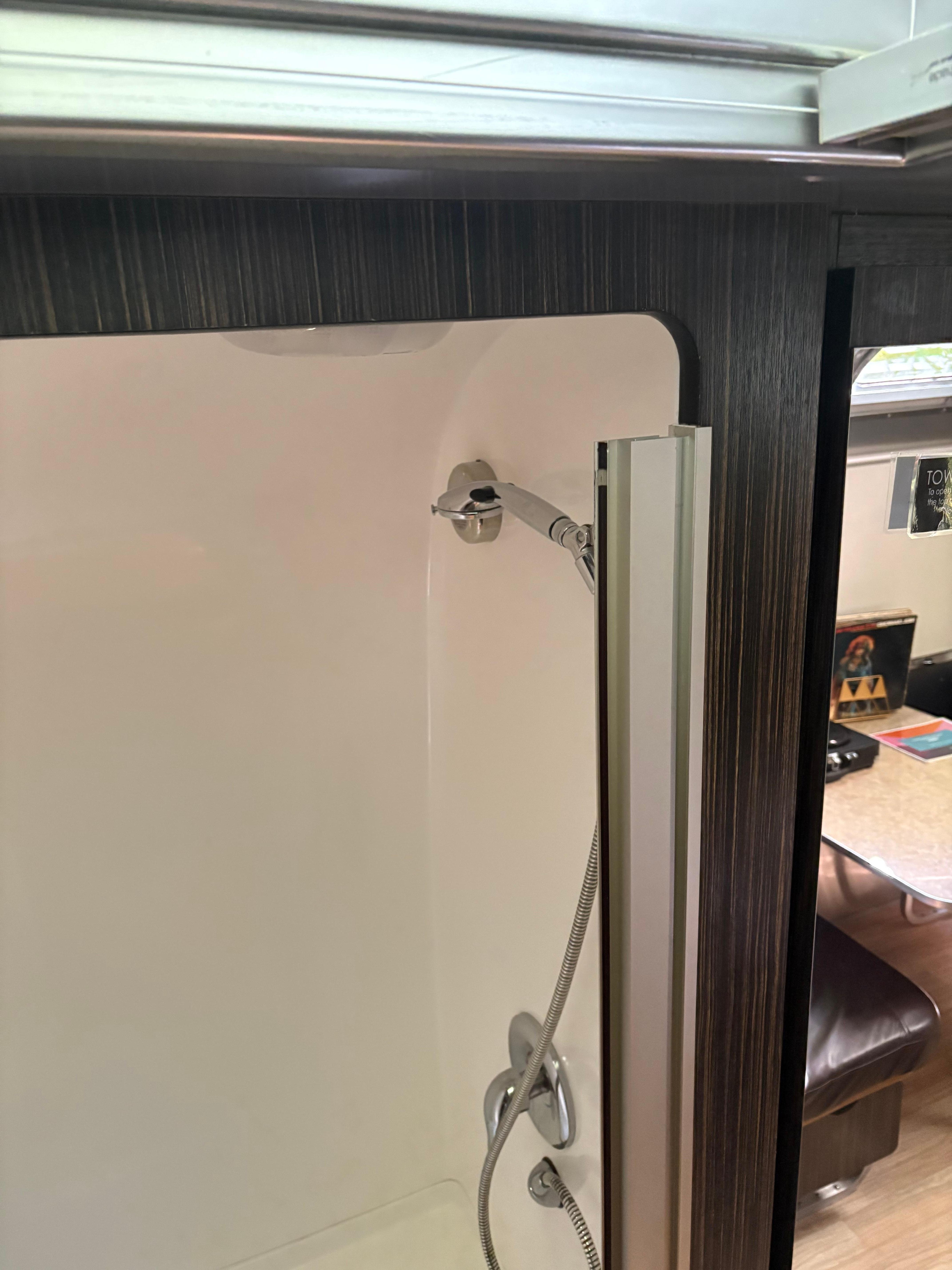 The shower is very small. Most likely you will use the shared one.