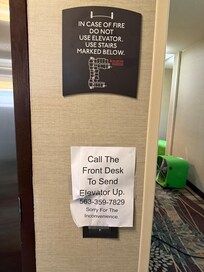 Elevator sign at 4th floor