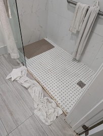 No door or curtain to prevent water from spilling out.