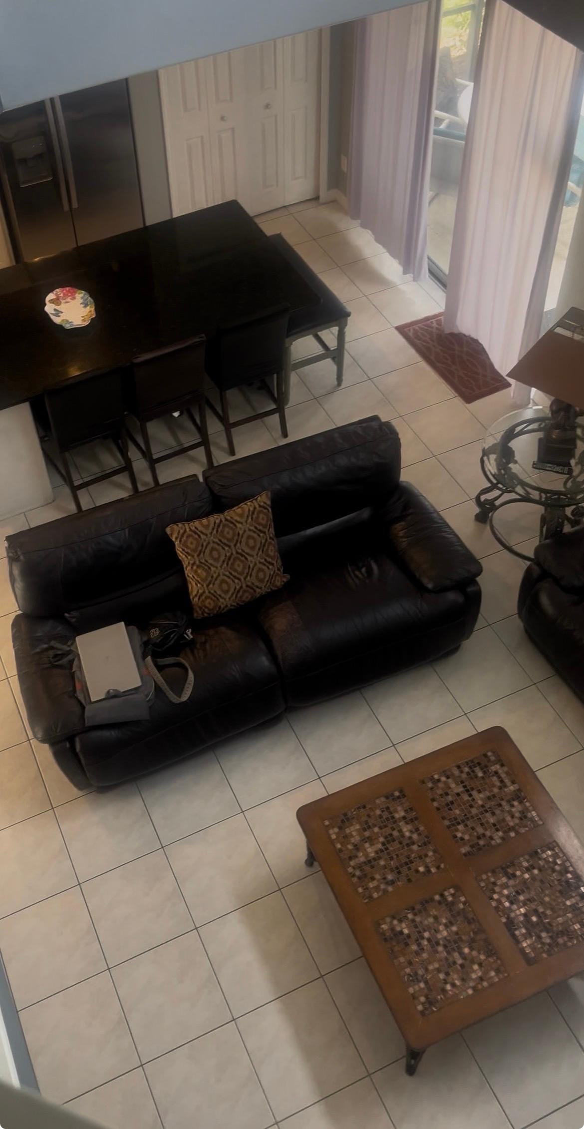 View from upstairs down to the living room and kitchen. 