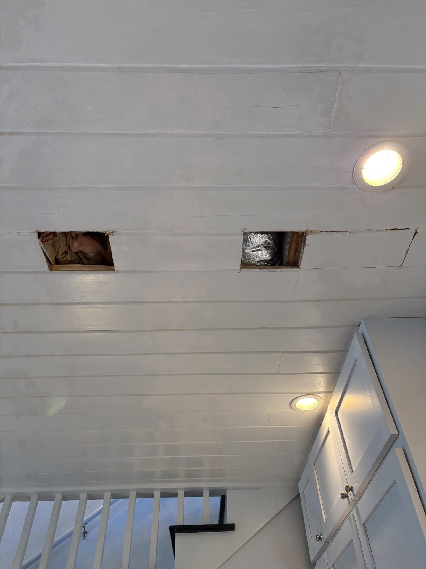 Ceiling above kitchen, dining table, and living room