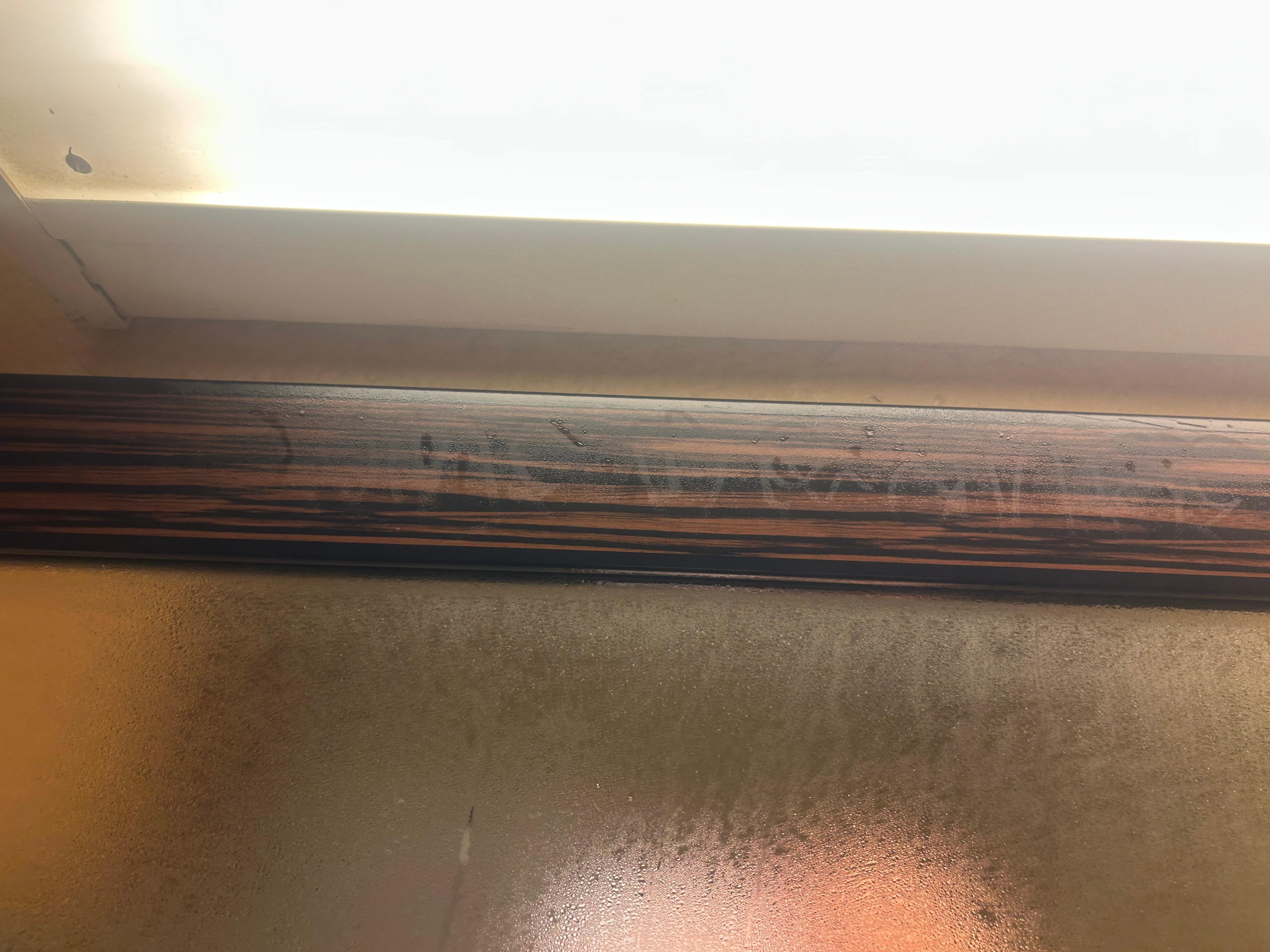 Bathroom steam reveled writing on the frame of bathroom mirror 