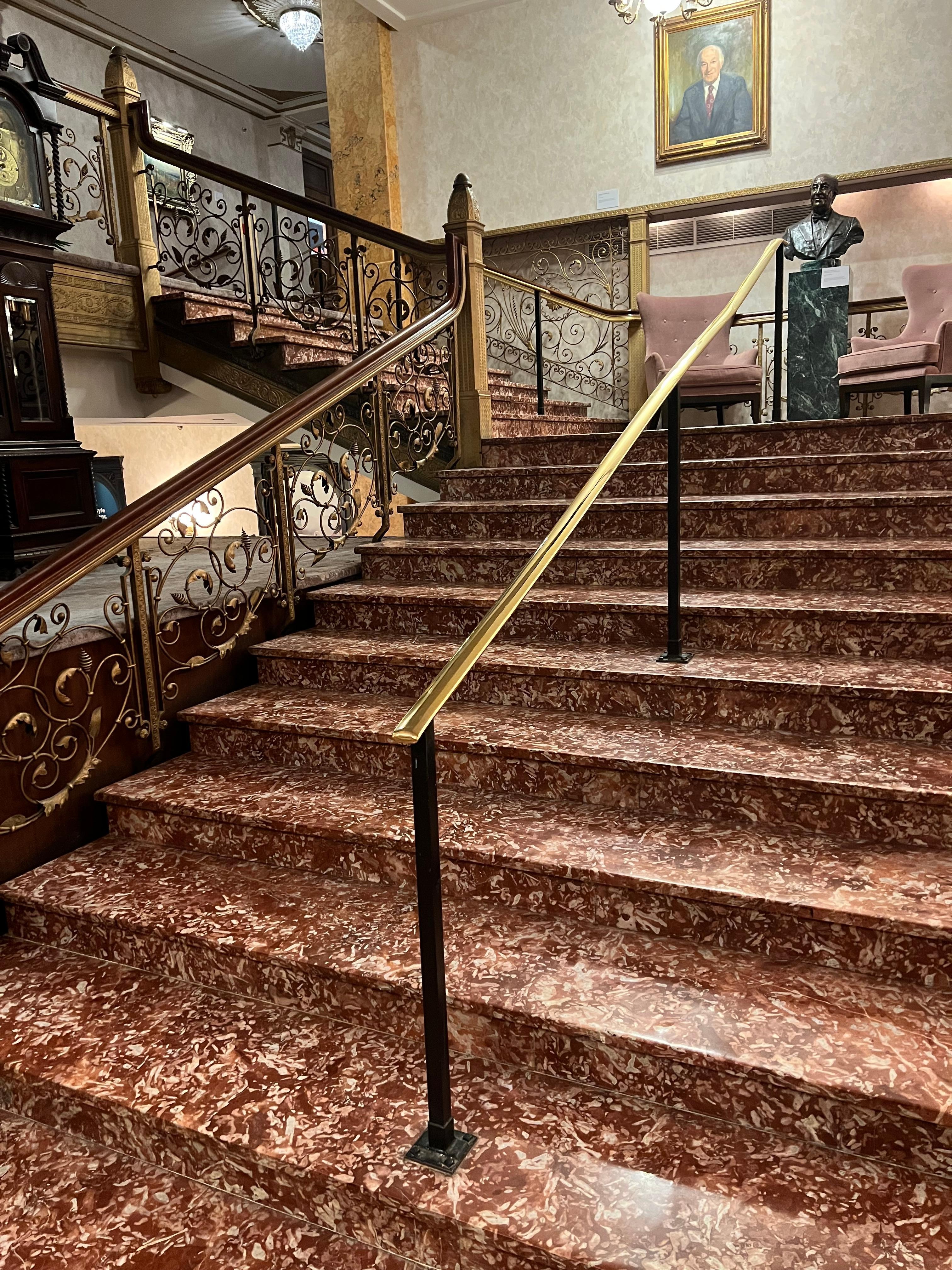 Gorgeous open staircase showcasing the history of Pfister. 