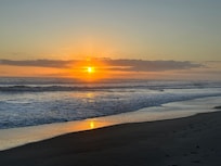 Beautiful sunrise walks on a nearly empty beach.