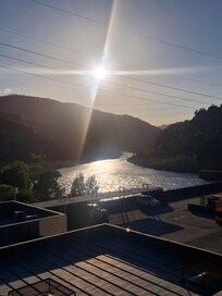 View from bridge of river and weir