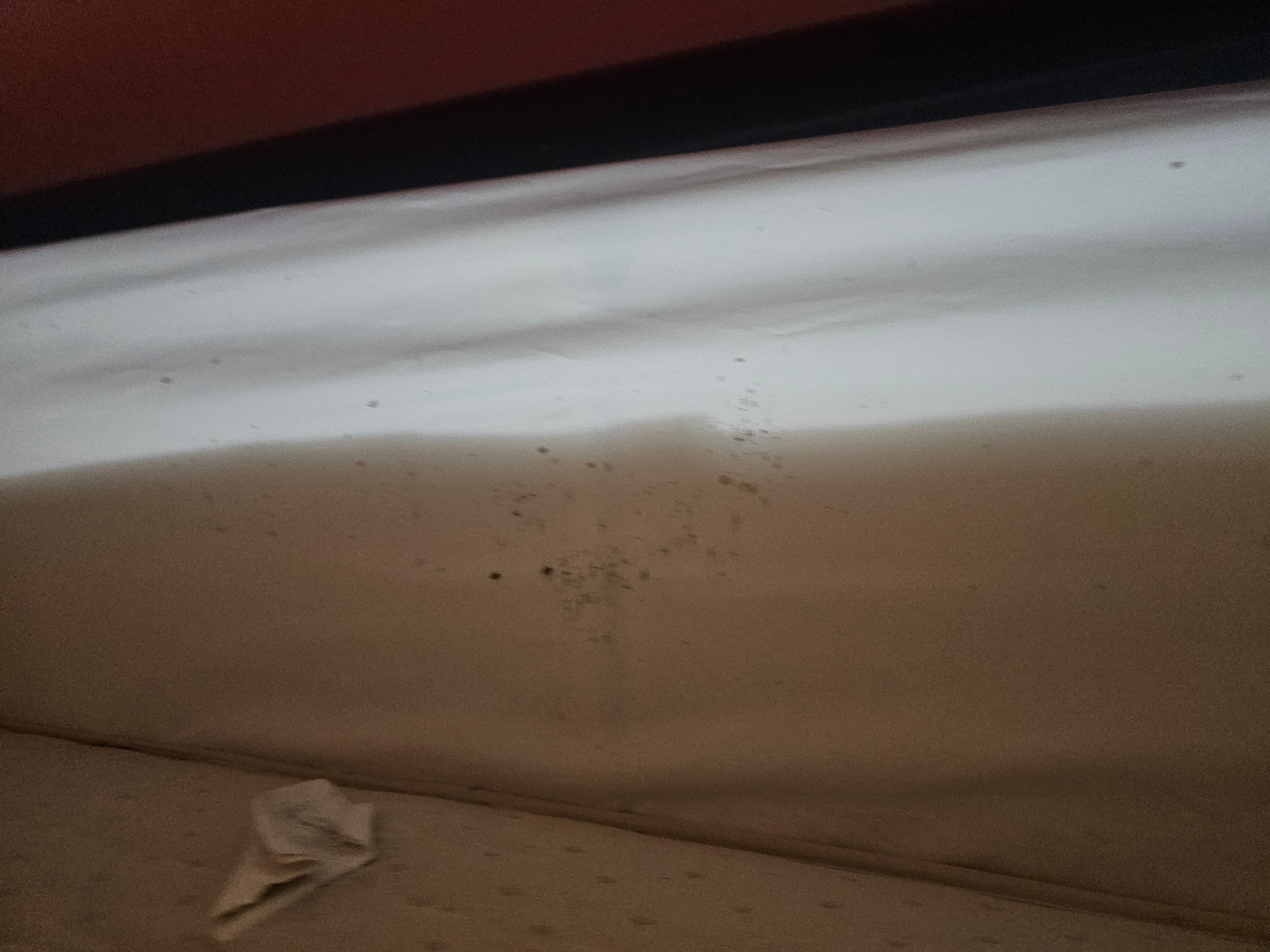 Under the mattress on top of the base.