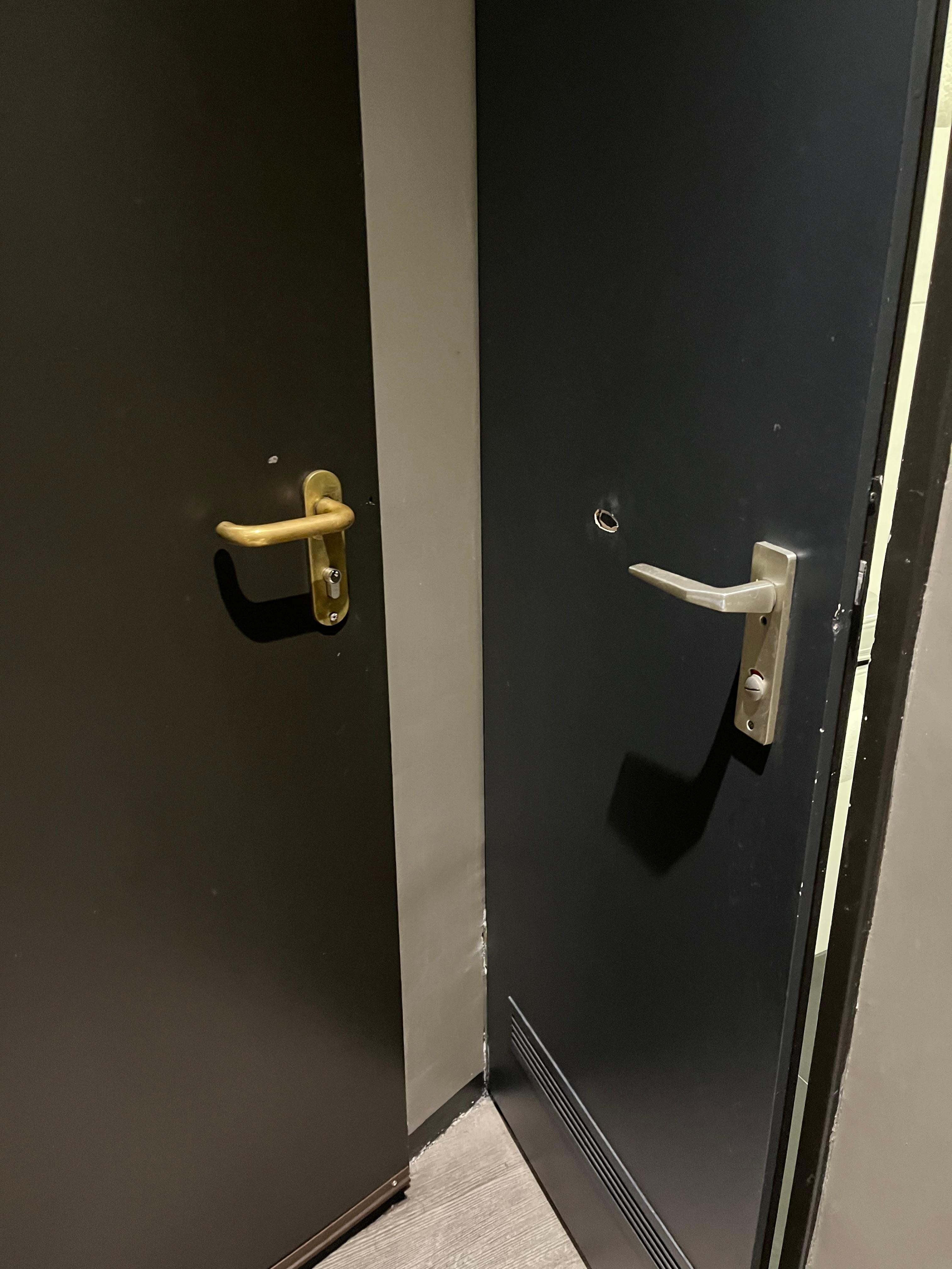 Bathroom door on right doesn't open fully because it hits entrance door. See damage.